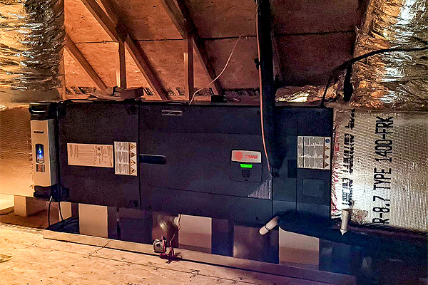 A large HVAC machine installed in an attic for optimal air quality