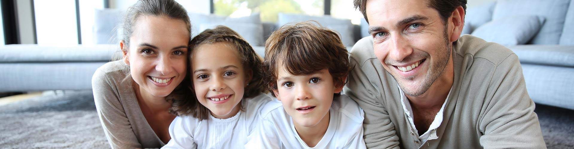 A group of children smiling for a picture at a community event