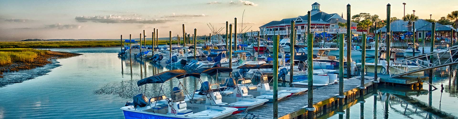 A group of boats docked in a harbor near a serviced HVAC location