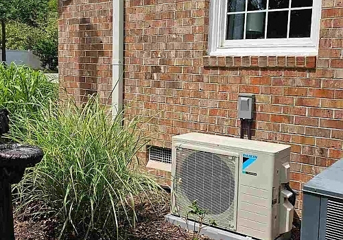 A heat pump outside a brick structure ensuring proper temperature control