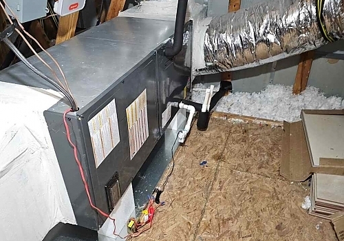 An HVAC system being installed in a basement for heating and cooling