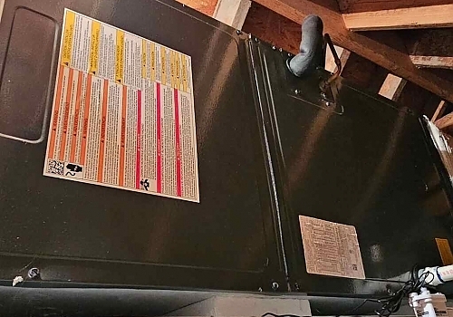 A white air conditioner mounted on a wall in a residential home