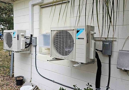 A black HVAC machine installed in a doorway for temperature control